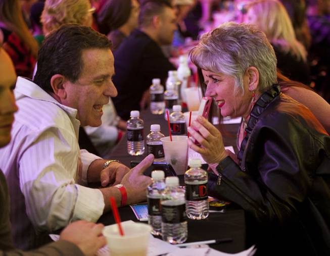 Singles chat across the table from each other at the D Date-a-thon outside the D Las Vegas along the Fremont Street Experience on Friday, Feb. 14, 2014.  L.E. Baskow